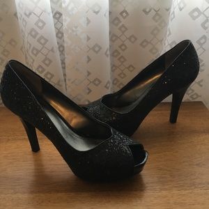Black glitter peep toe heels.